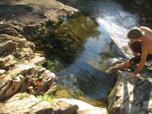 Jeff Shaw testing the water before taking a morning dip in the spring